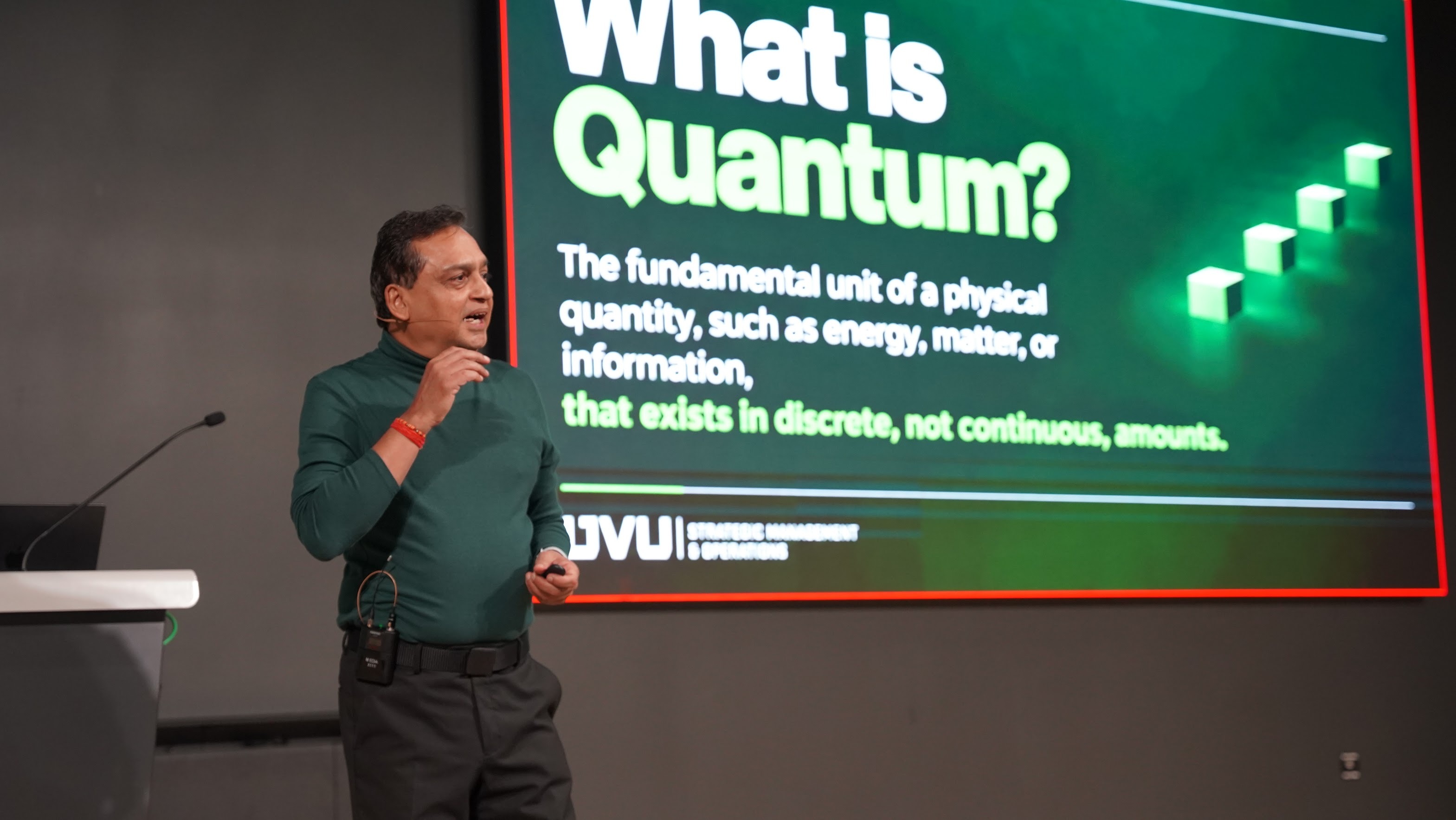 Sumit Parashar explaining quantum concepts during a presentation at Utah Valley University.